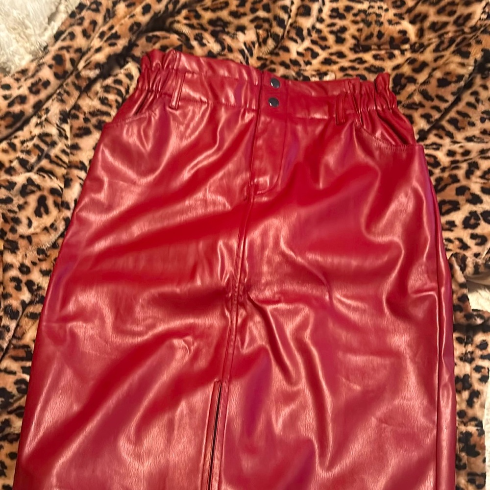 Red faux leather above the knee skirt with slit